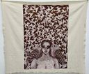 A printed cloth hanging at St. Andrew’s Parish Hall showing a woman’s face flanked by two large birds against a pattern of flying birds.