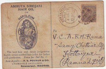 A weathered 1922 postal card advertising Amruta Sirojani hair oil, with a handwritten address and postmark stamp.