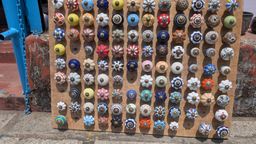 Board of colorful ceramic door knobs for sale