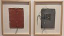 Two framed pieces of textured handmade paper artwork stitched with coloured thread, hanging on a white gallery wall at Muziris Contemporary.