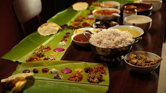 A traditional Kerala sadhya meal served on a banana leaf.